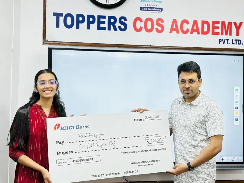 Ranveer Singh presenting a cash reward cheque to a high-achieving student